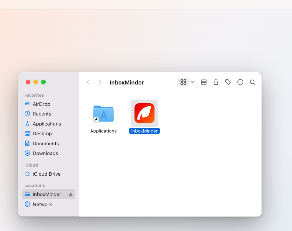 The mounted disk image in Finder: drag InboxMinder to Applications